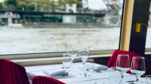 Refined table with daytime Seine River view from the boat