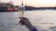 Glass of champagne served on board during a Seine River aperitif cruise