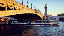 Le Grand Pavois boat passing under Pont Alexandre III at sunset