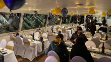 Room decorated with balloons for a New Year's Eve dinner cruise on the Seine