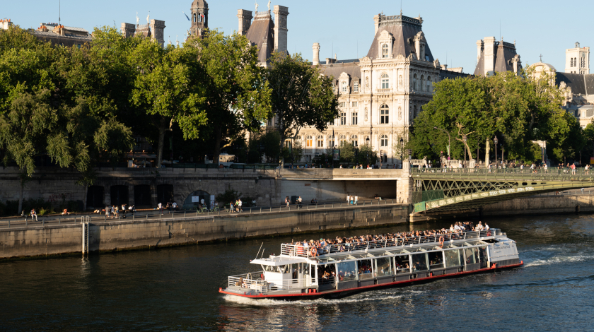 The Hydraseine boat passing by Paris City Hall during a Seine river cruise